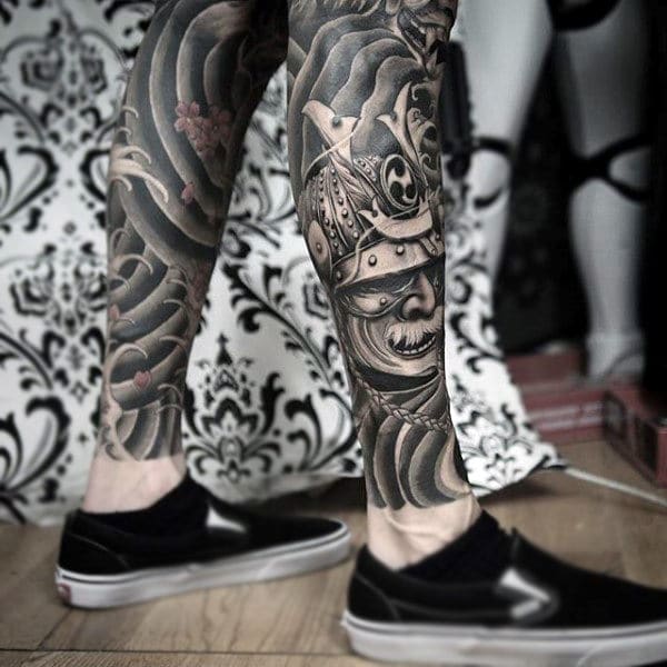 modern tribal samurai mask leg tattoo