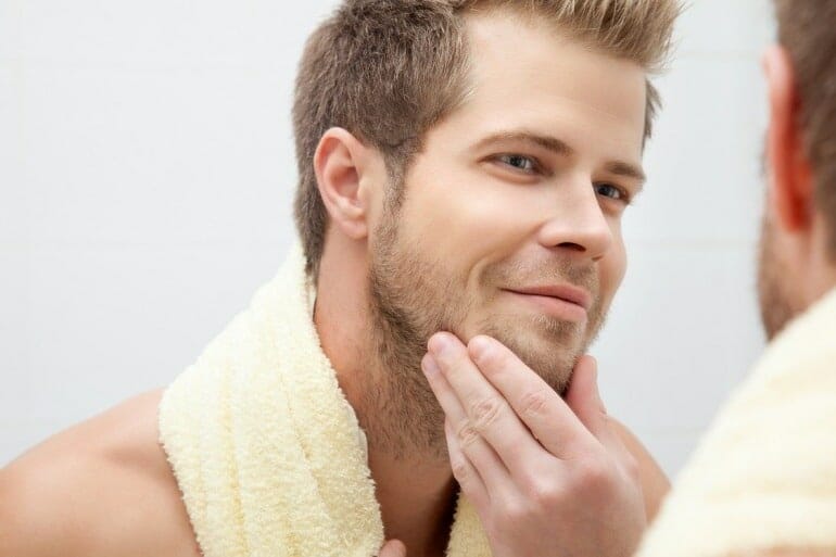 Man grooming face