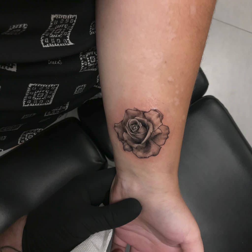 Traditional rose tattoo on wrist Outsons