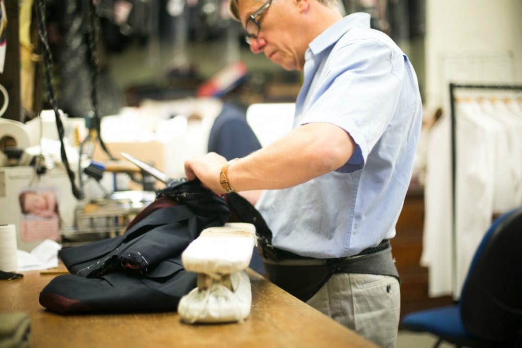 a man tailoring a suit at norton and sons