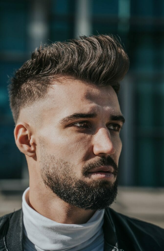 Side Part Haircut With Mohawk And Defined Sides