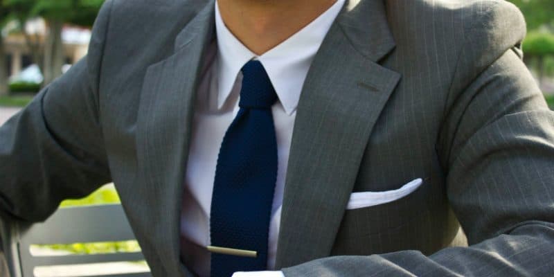 grey suit white shirt blue tie white pocket square mens