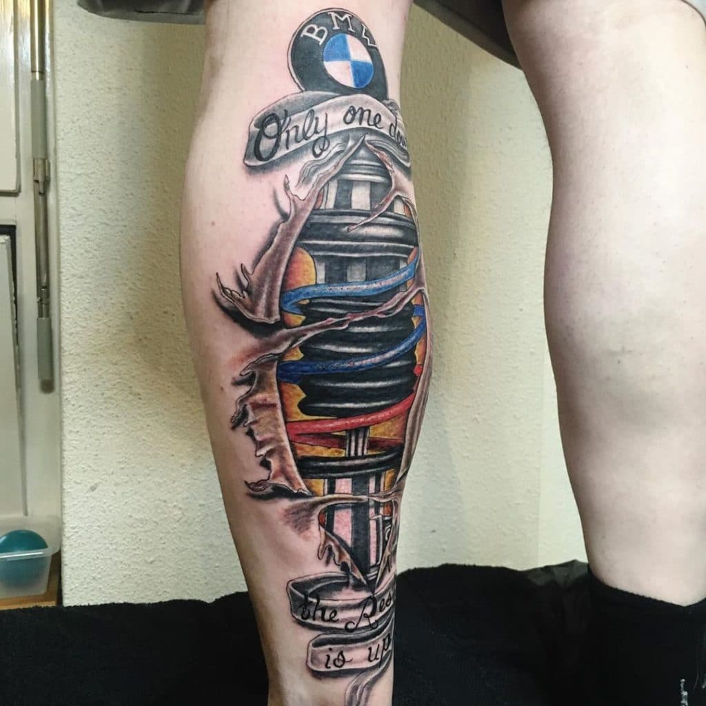 Black and Grey Alien BMW car Tattoo on the Leg