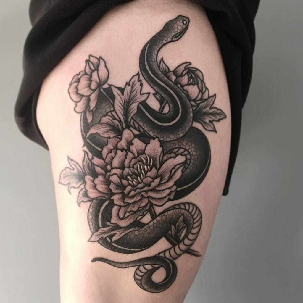 Snake tattoo on thigh