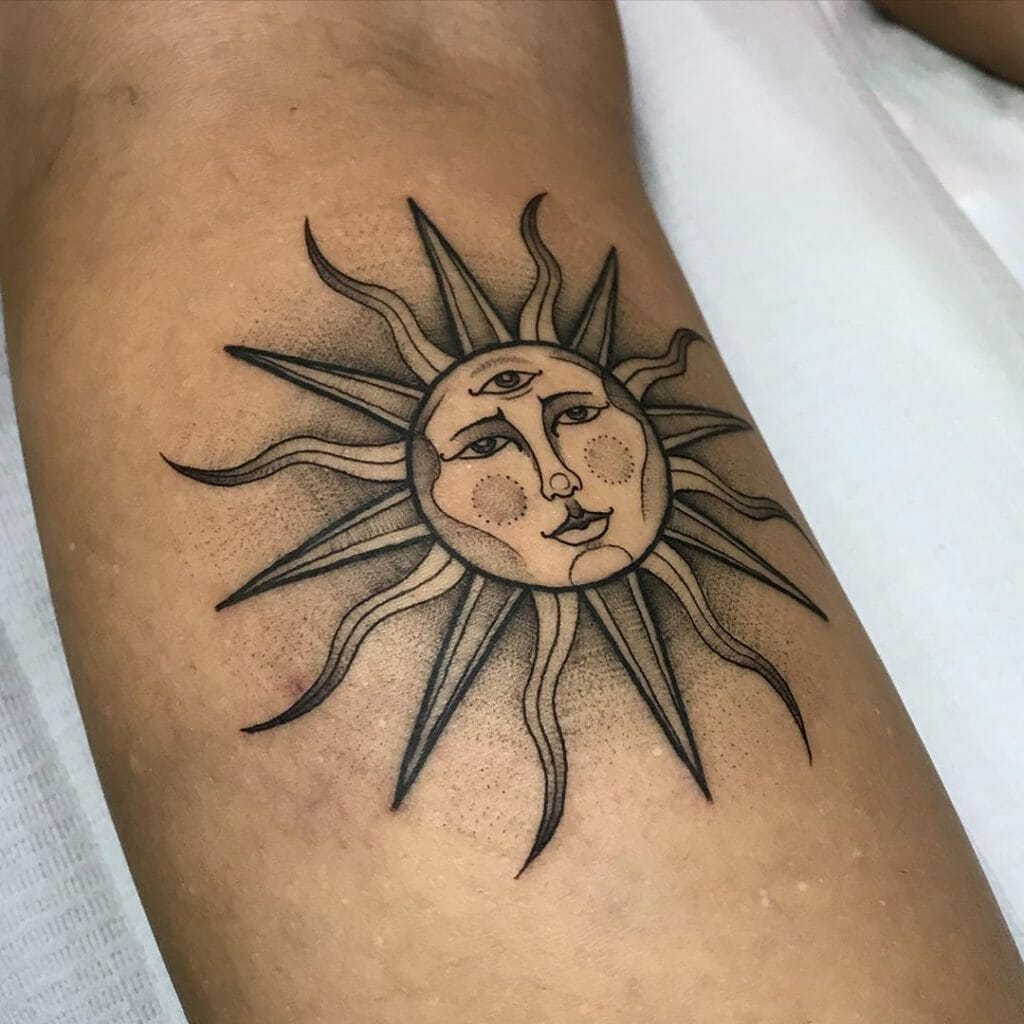 Sun with face tattoo