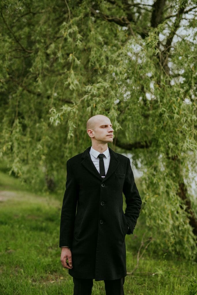 Bald with in a suit and tie