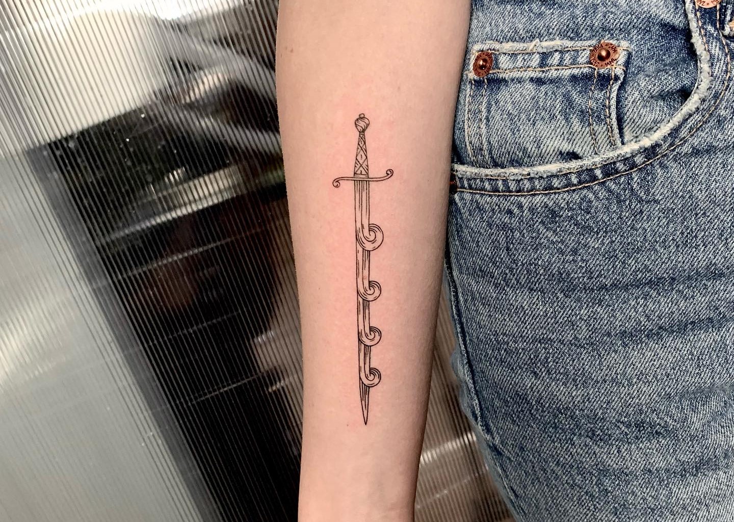 Tiny sword tattoo by Nadav Abras - Tattoogrid.net