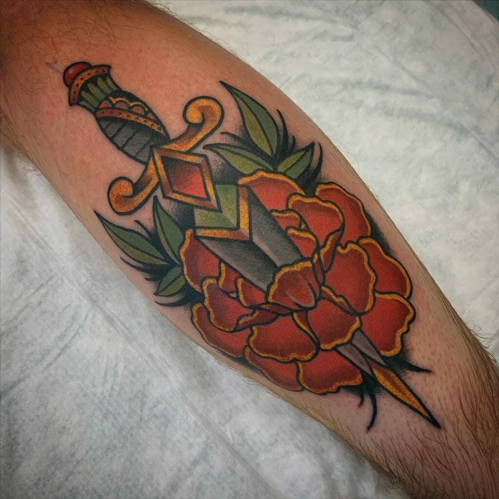 Dagger Through Marigold Flower Tattoo