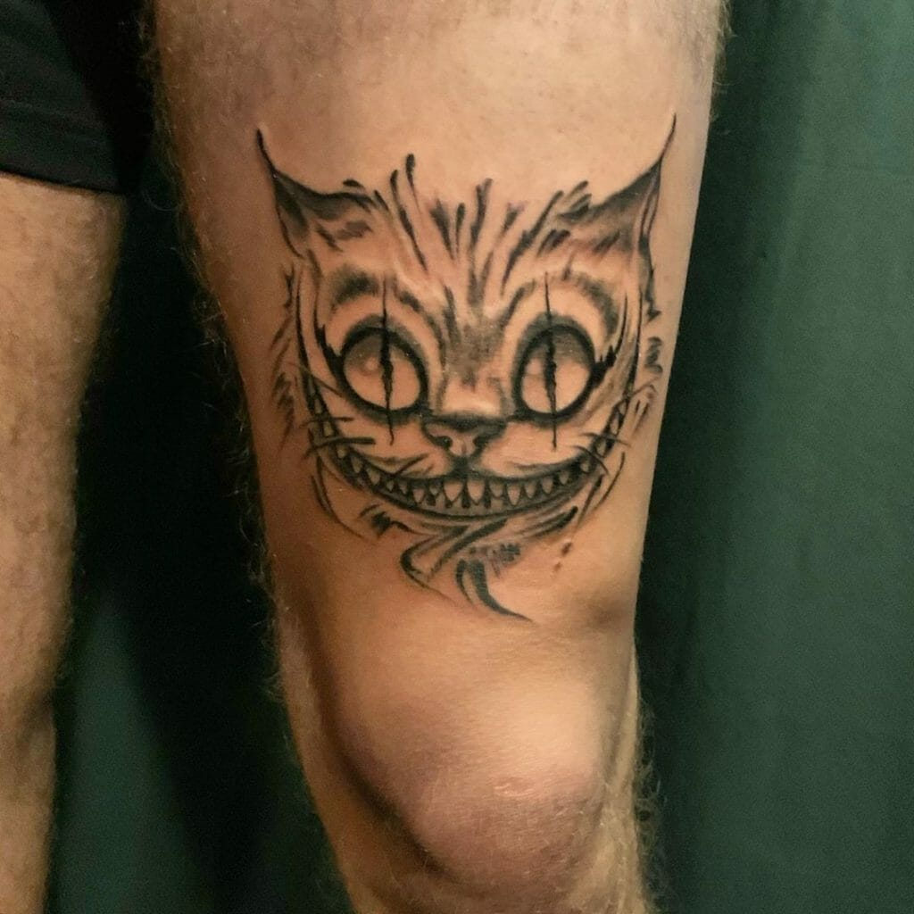 Minimalistic Thigh Cheshire Cat Tattoo