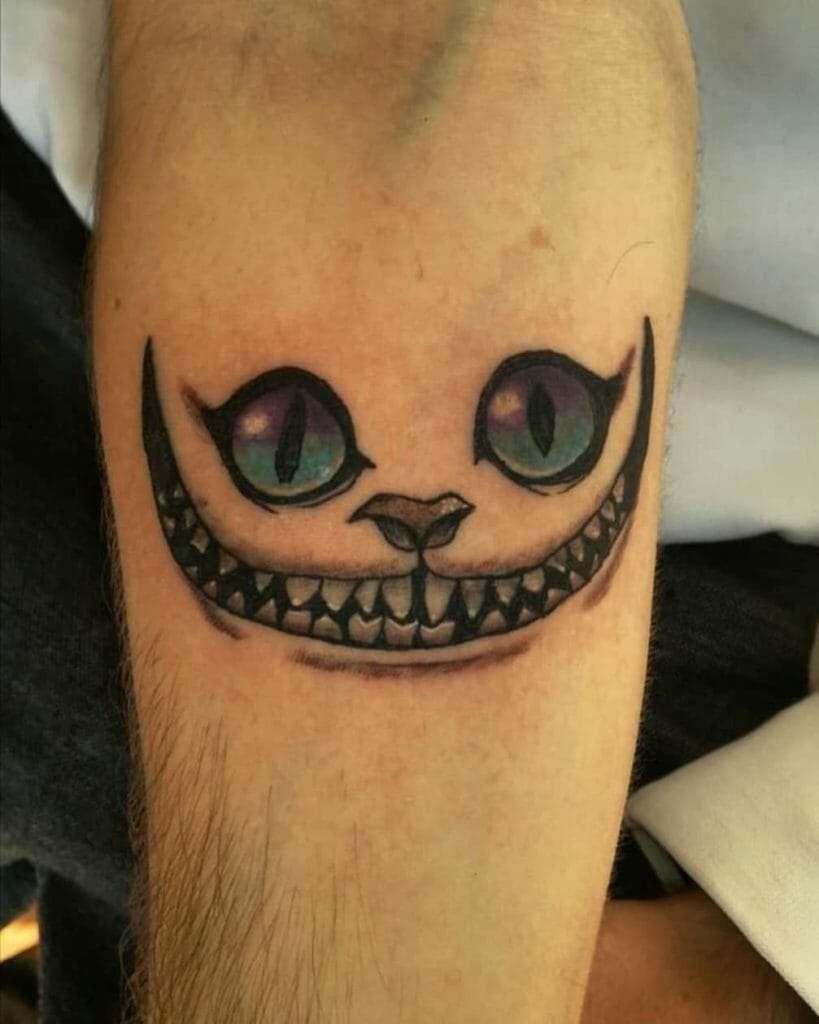 Small Black and Gray Cheshire Cat Tattoo with Colored Eyes