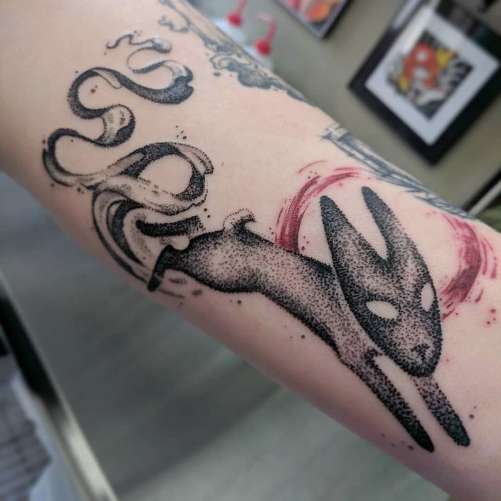 Black Rabbit Tattoo With Red Lines