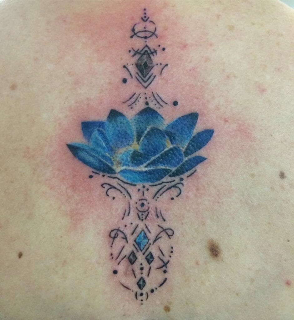 Blue Lotus Back Tattoo With Ornamental Lines
