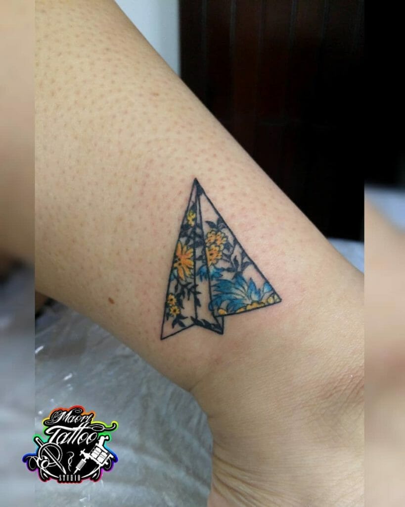 Blue and Yellow Flower Origami Paper Airplane Tattoo Design Idea
