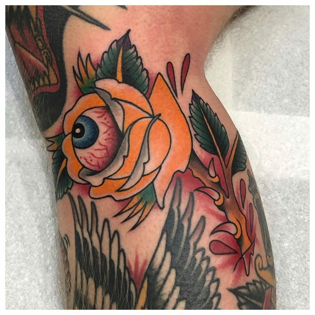 Colored Bold Eye Tattoo With A Rose Image