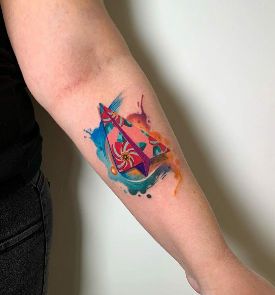 Colorful Watercolor Splash Paper Plane Tattoo Forearm Placement