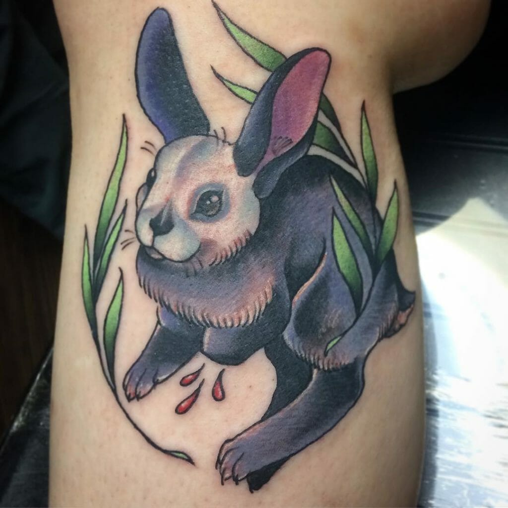Giant Black Rabbit Tattoo With Green Details