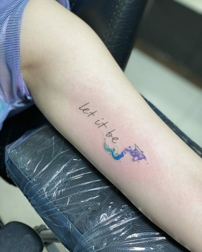 Let it Be Tiny and Colorful Paper Plane Tattoo Design