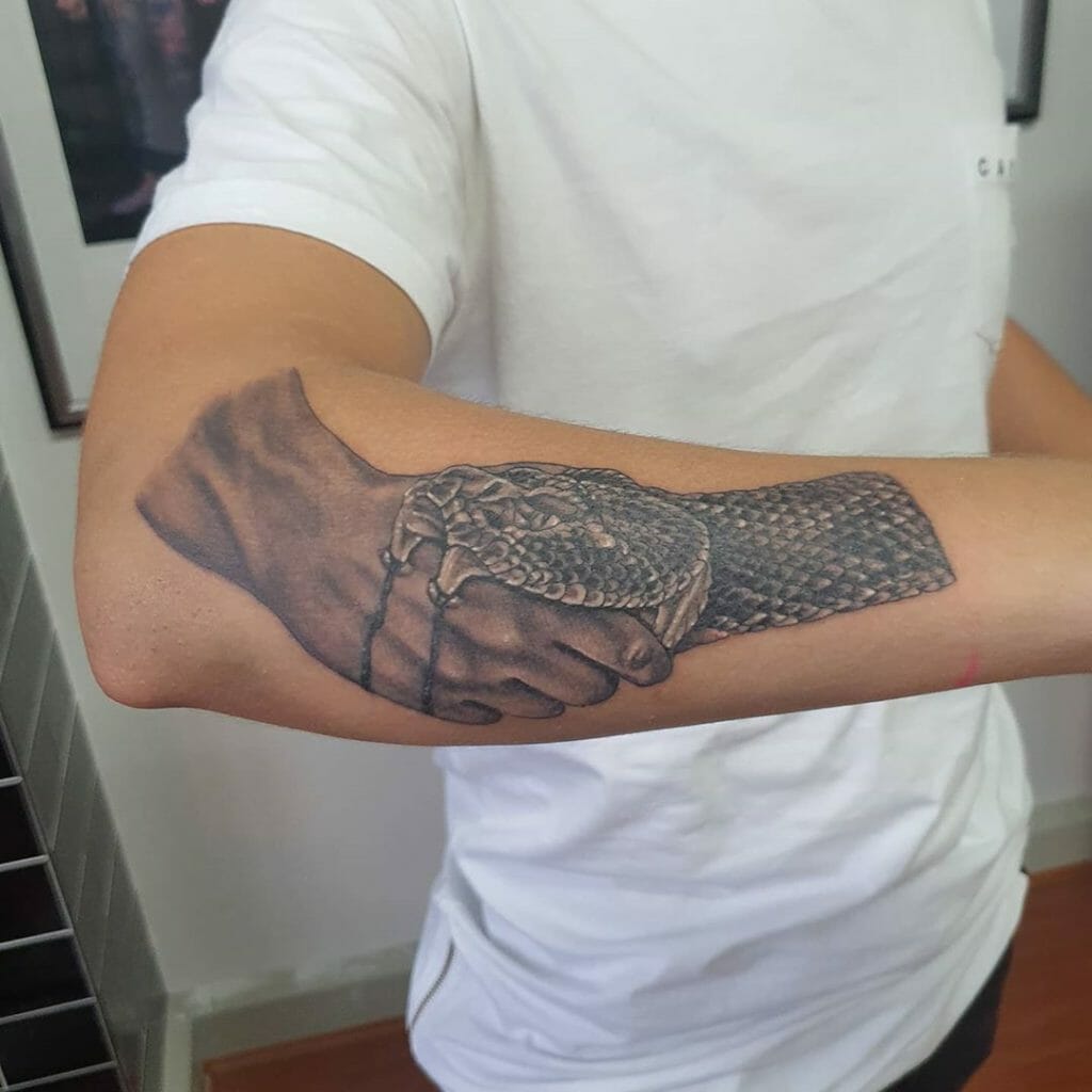 Realistic Greyscale Snake Biting Handshake Trust No One Tattoo