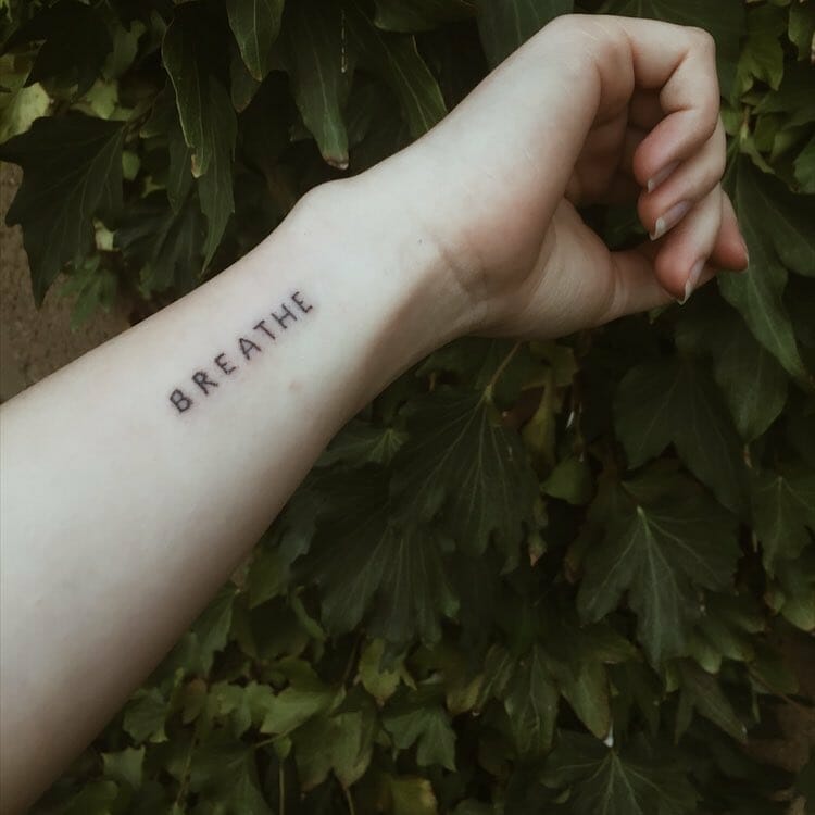 Simple Black Ink Just Breathe Tattoo Wrist Placement