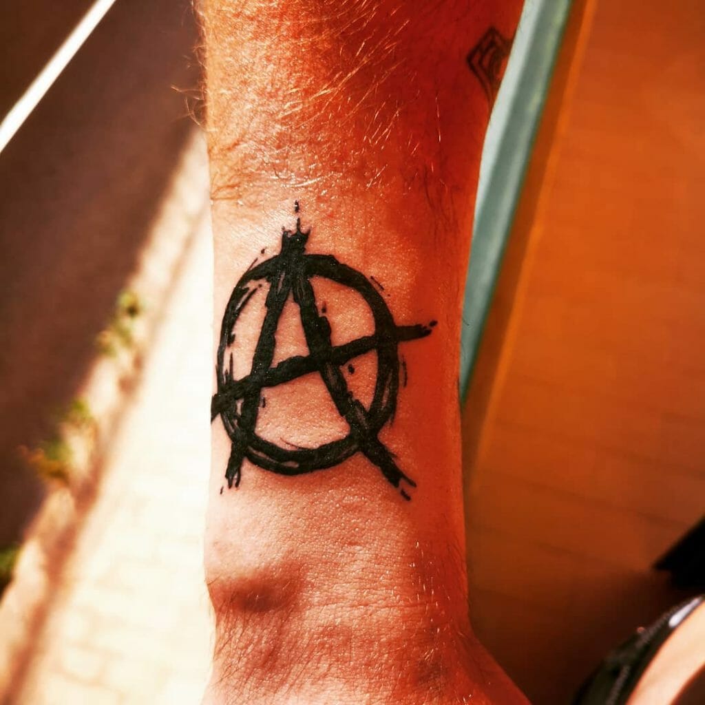 Simple Sketchy Anarchy Symbol Tattoo Idea Done In Black Ink Arm Placement.