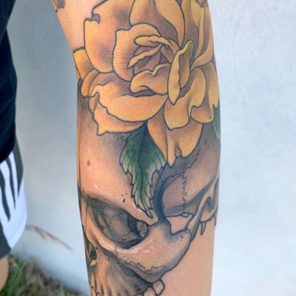 Sleeve Tattoo Of A Rose And Skull