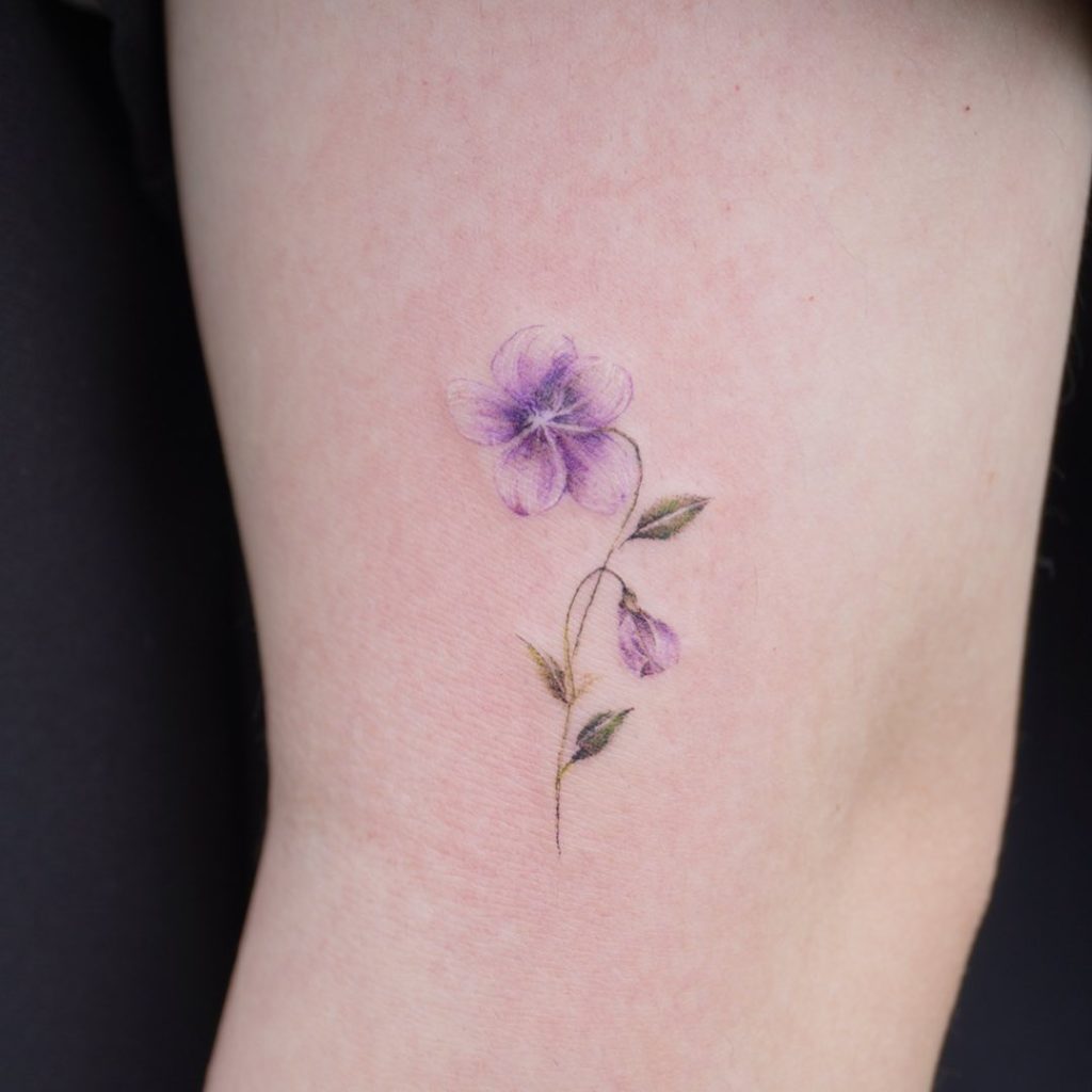 Small And Subtle Violet Tattoo Design