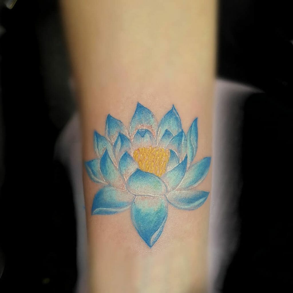 Small Blue Lotus Flower With Yellow Center Tattoo Design