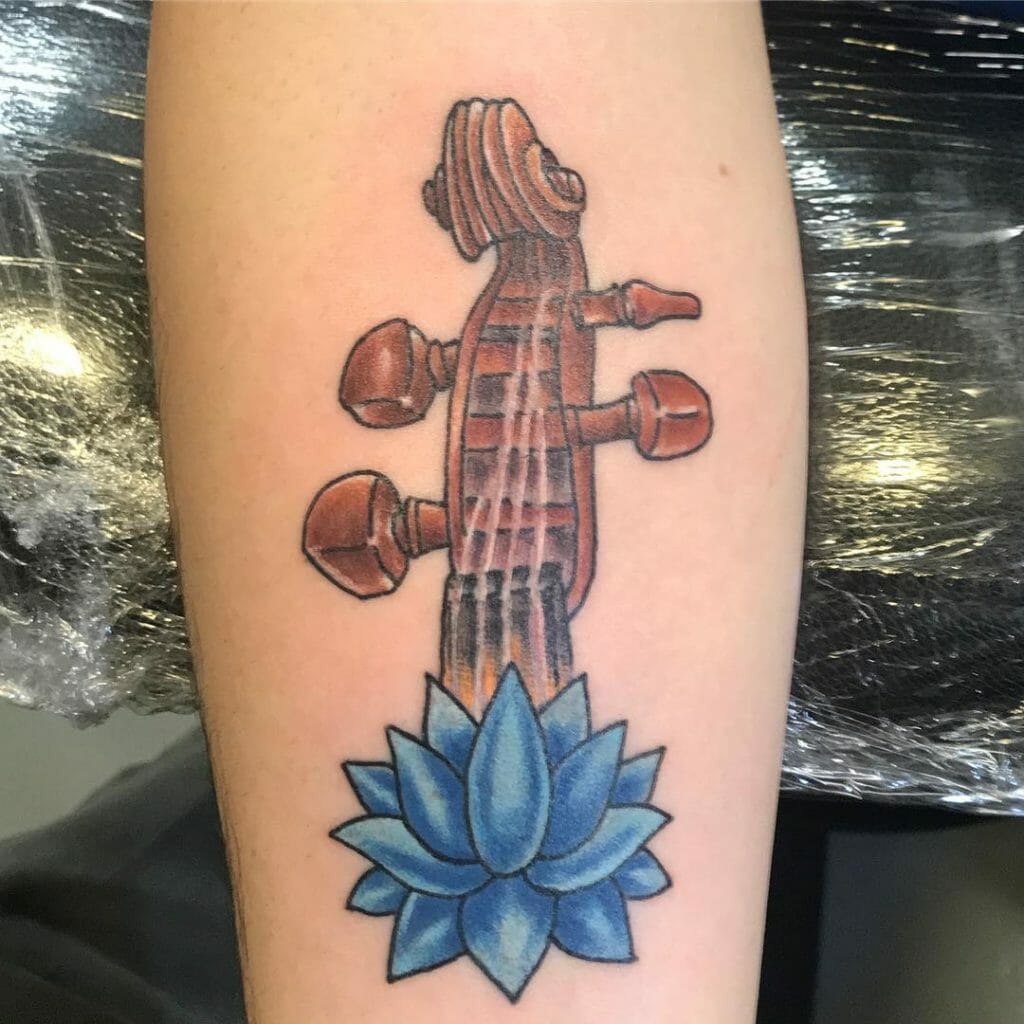 Unique Blue Lotus and Violin Tattoo Design