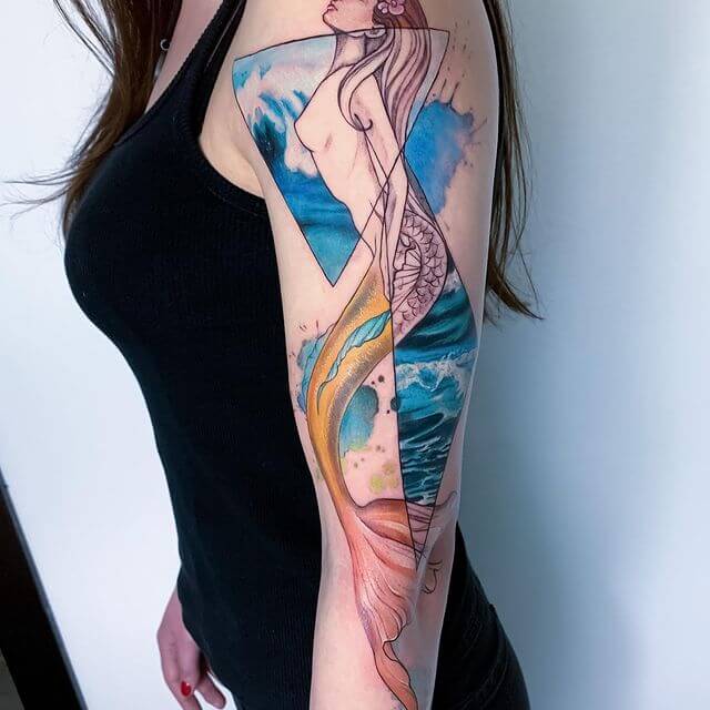 Large And Colorful Image Of A Siren Over Arms
