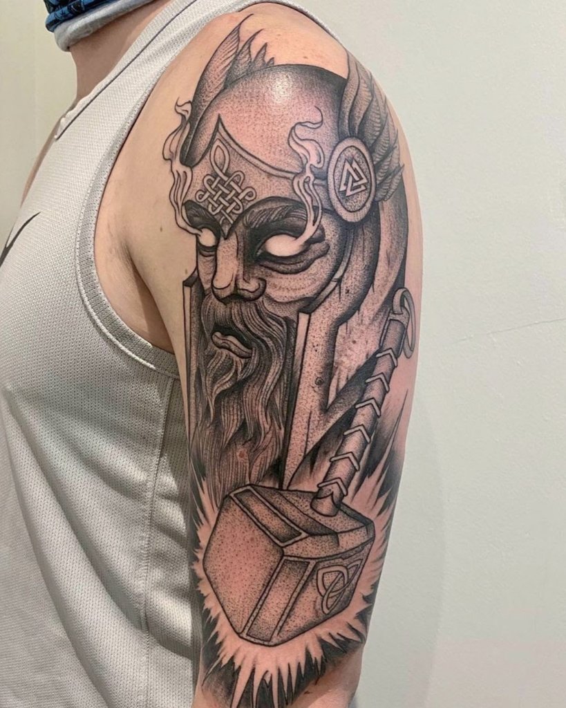 Shoulder Tattoos With An Image Of A God Of Thunder