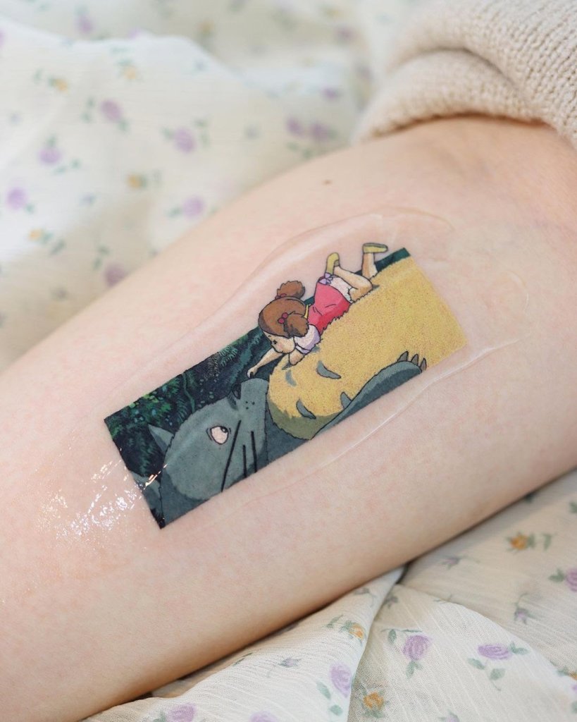 Small And Cute Colorful Totoro Tattoo On Forearm