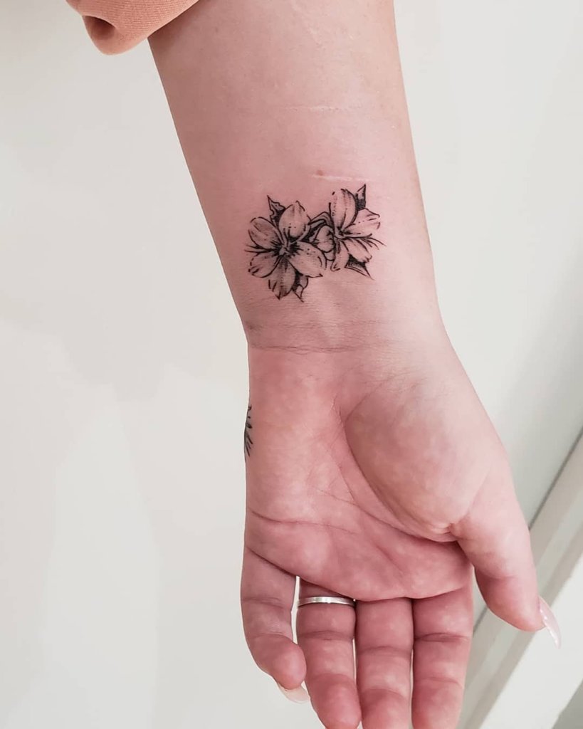 Small Plumeria Tattoo On Wrist