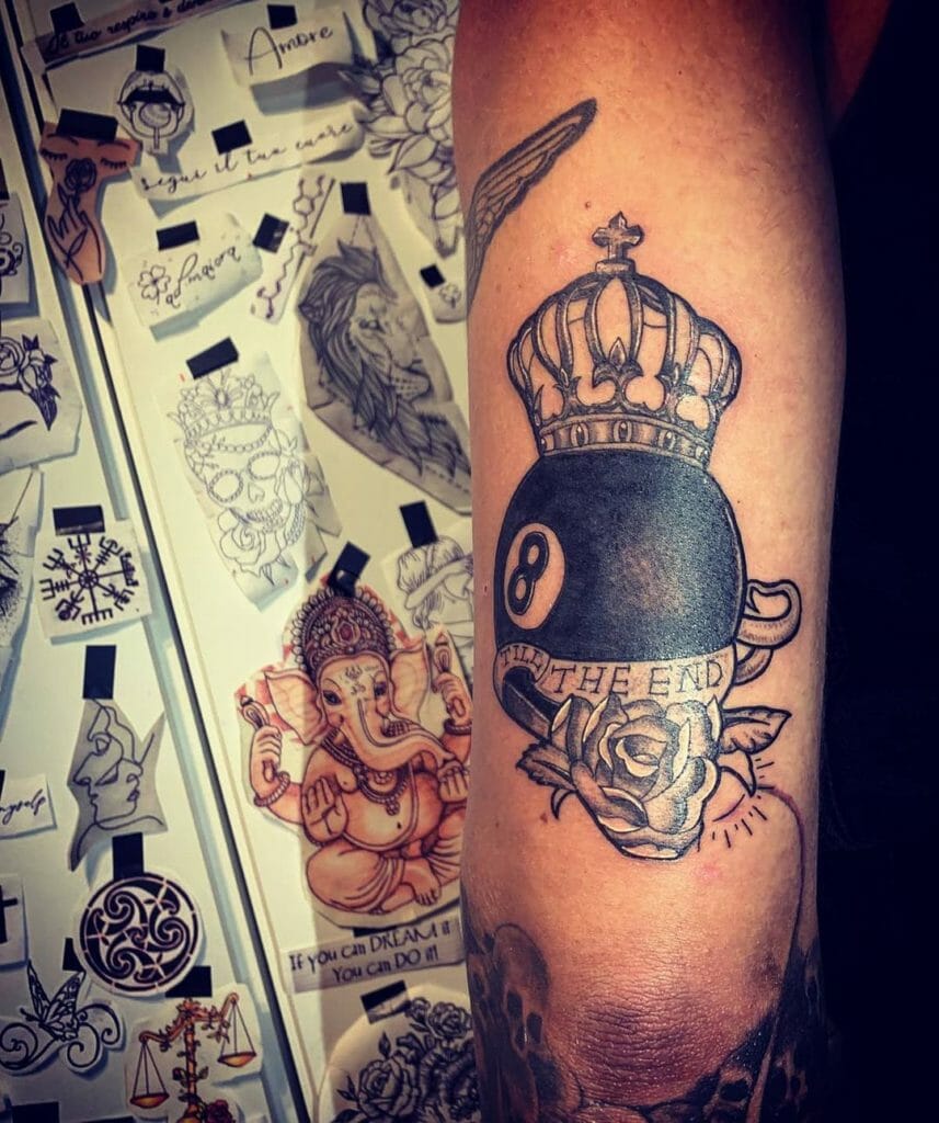 8 ball tattoo with a crown