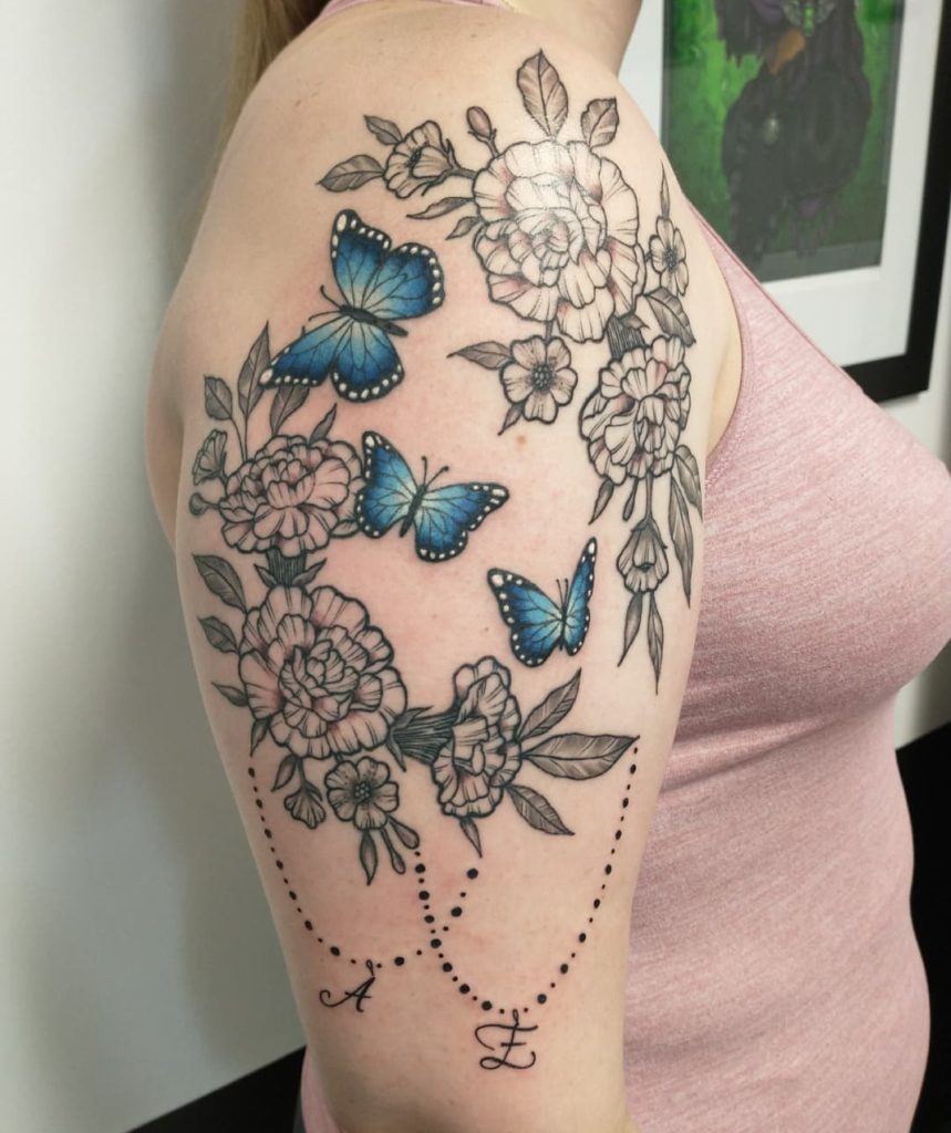 Adding Symbols And Motifs To Traditional Flower Tattoo