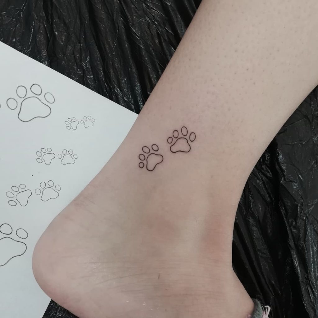Adorable Cat Paw Outline Tattoo