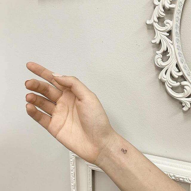 Ampersand tattoo on hand