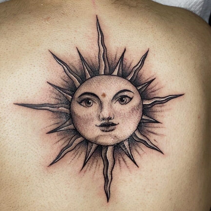 Black And White Sun With Docile Face Tattoos
