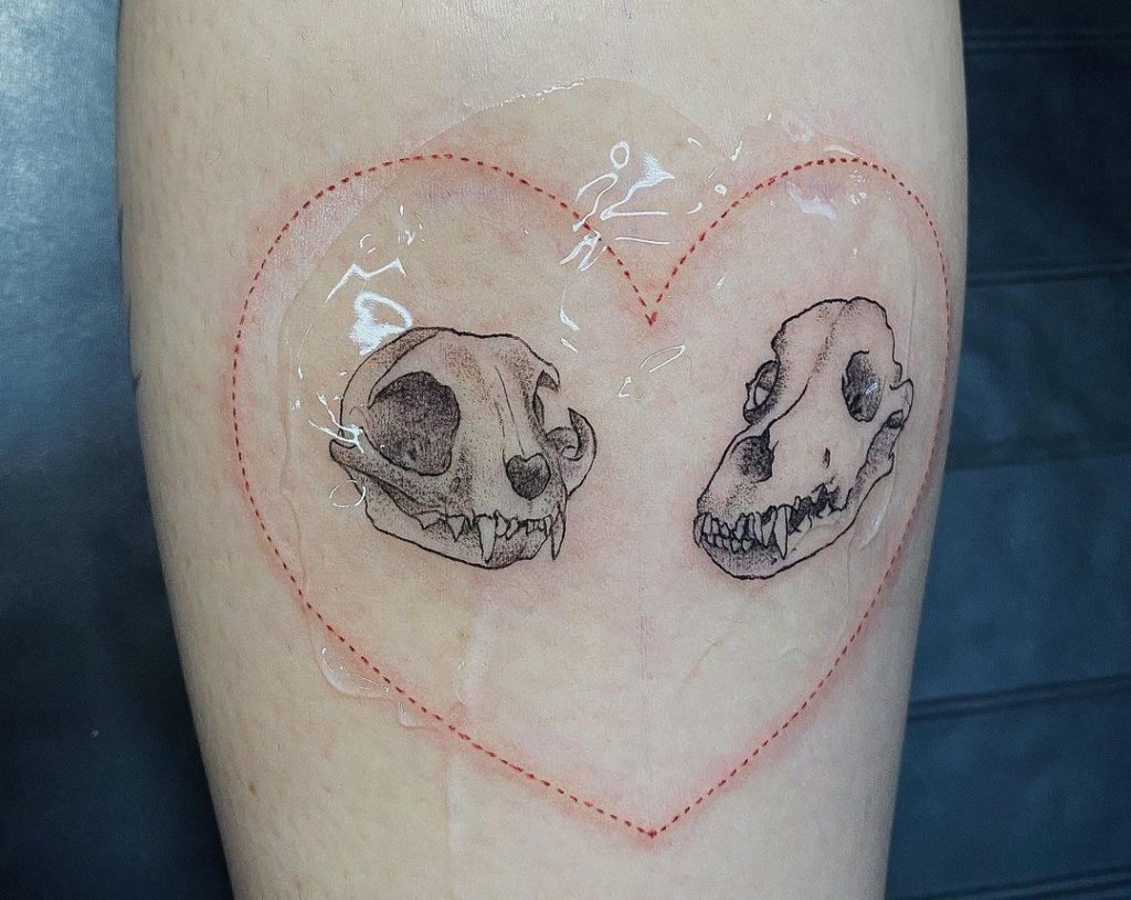 Cat And Dog Skull Tattoo