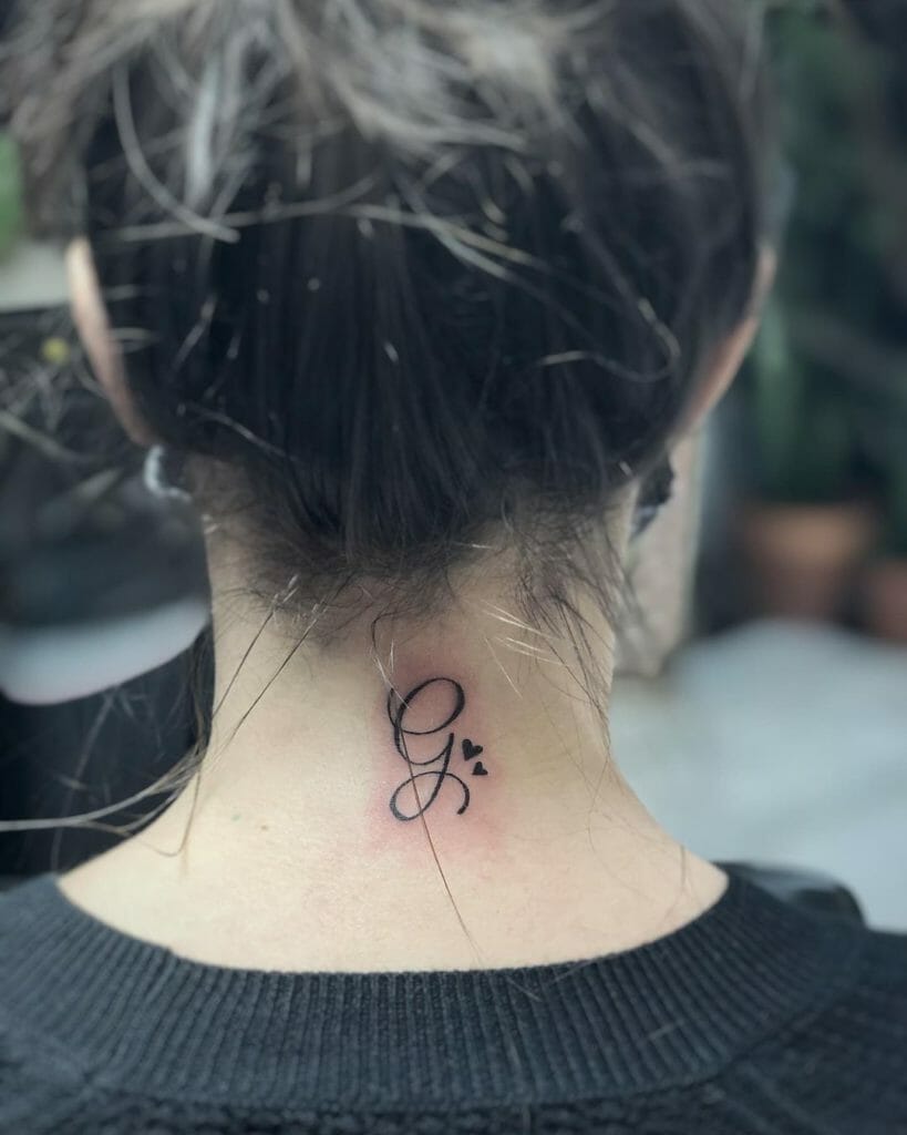 G Back of the Neck Tattoo