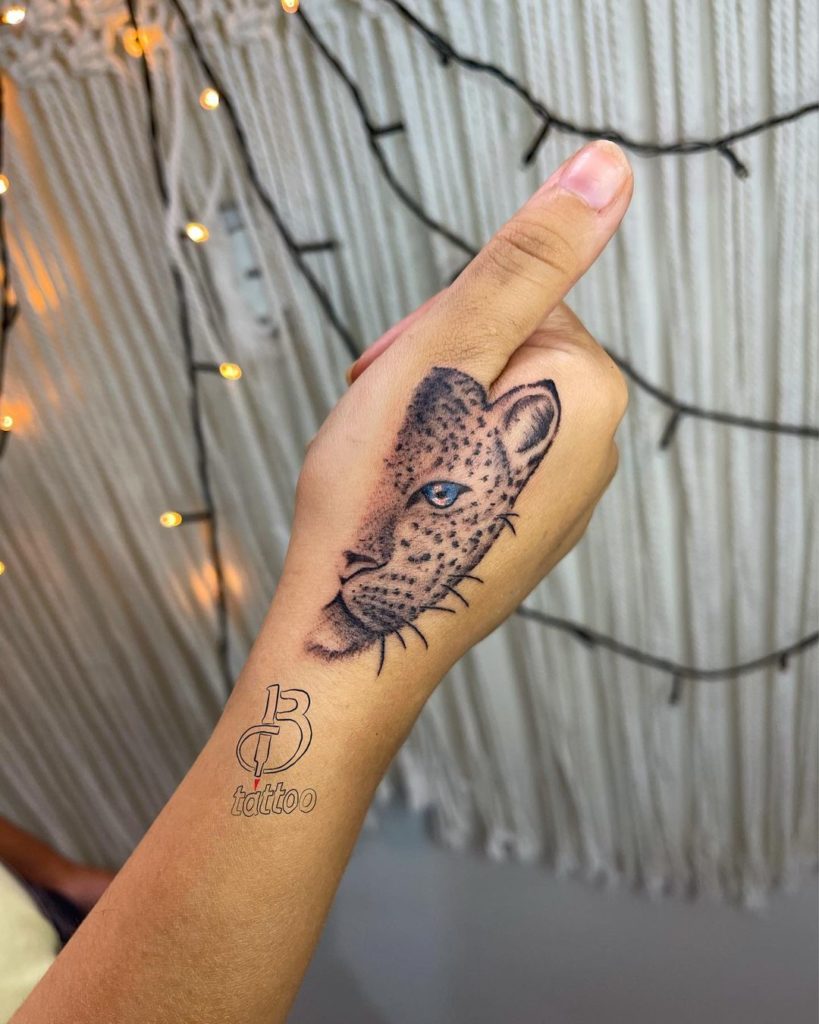 Half Cheetah Hand Tattoo