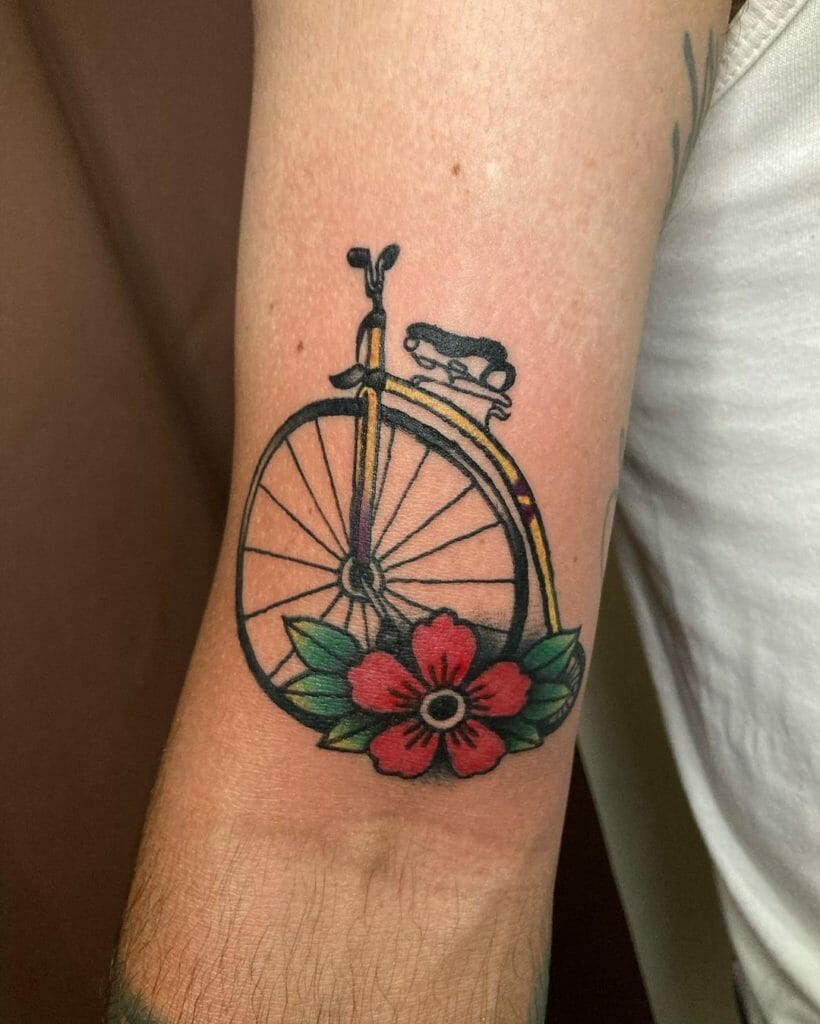 Old School Bicycle Tattoo With A Floral Detail