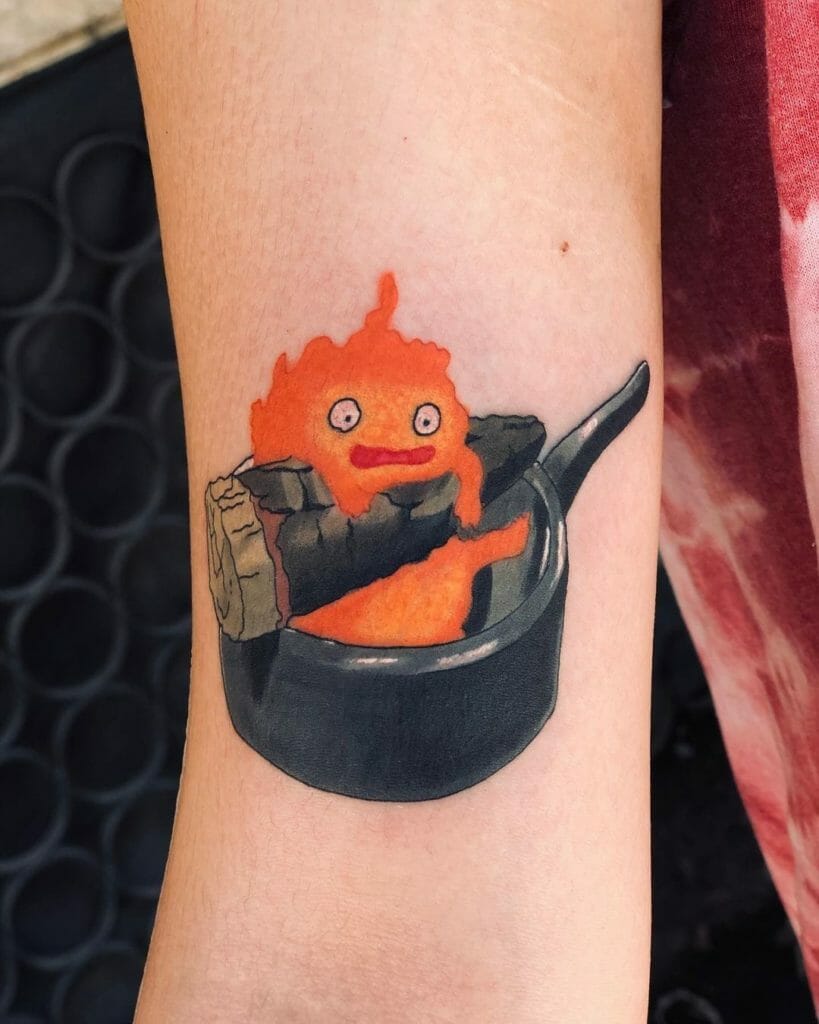 Quirky Calcifer Tattoo With A Frying Pan
