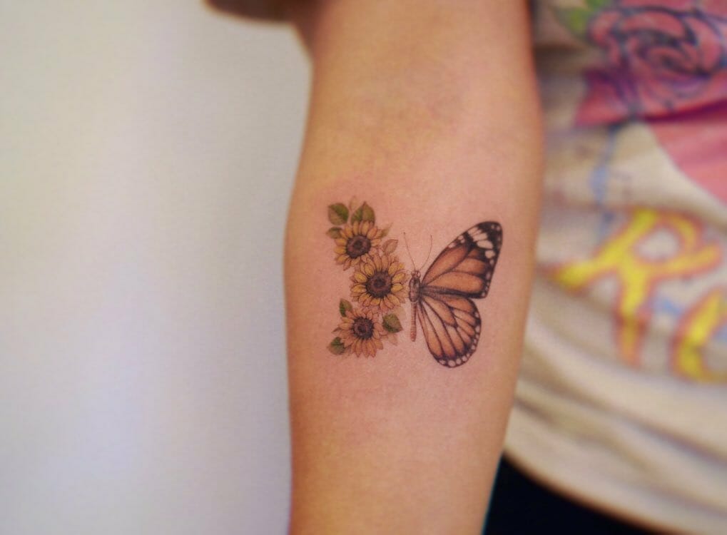 Stunning Half-Sunflower Half-Monarch butterfly Tattoo