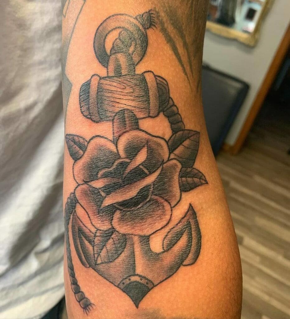 The Combination Of Flowers And Anchor Tattoos