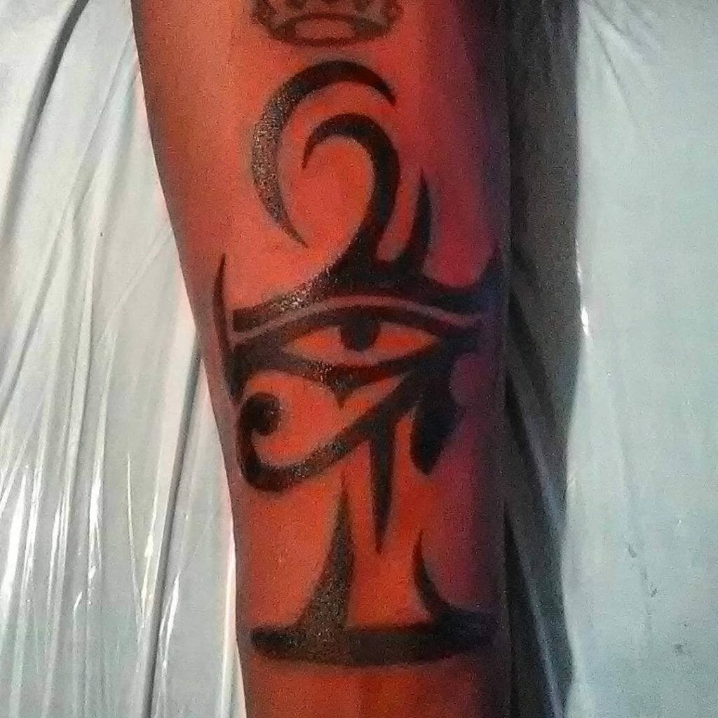 Tribal Eye Of Ra And Ankh Tattoos 