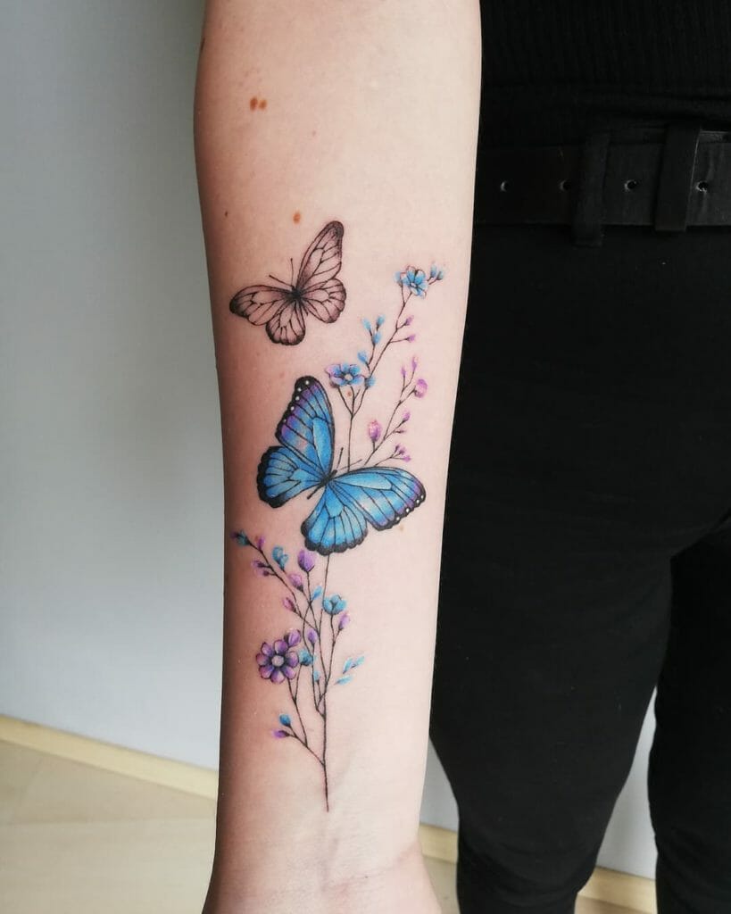 Two Butterflies Flying Around Flowers Tattoo
