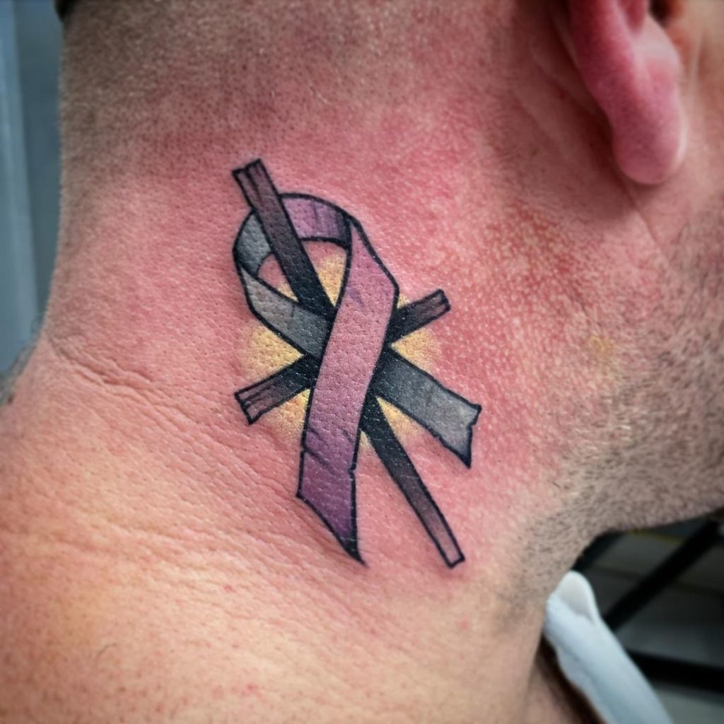 Cancer Ribbon Tied On A Cross Tattoo