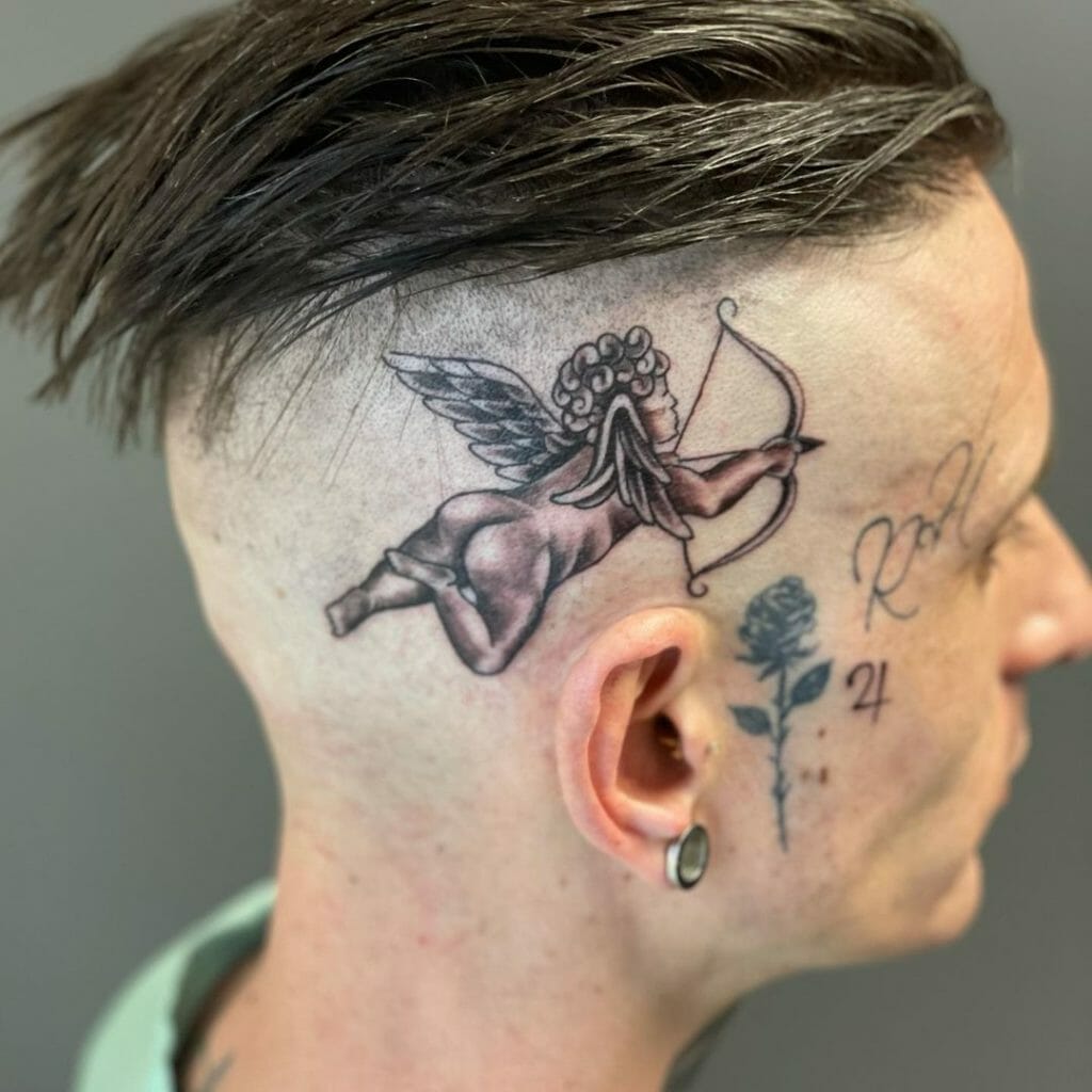 Cupid With Bow And Arrow Head Tattoo