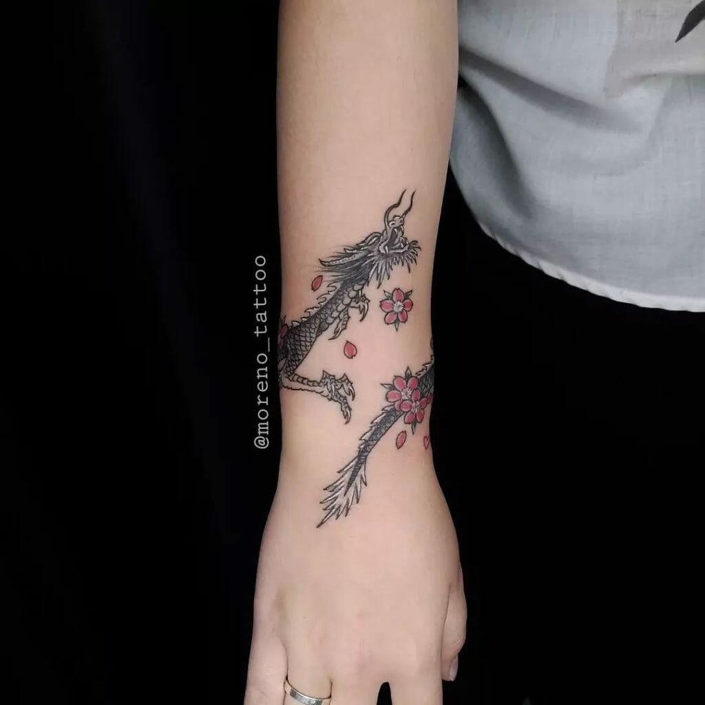 Dragon Arm Tattoo With A Cool Twist