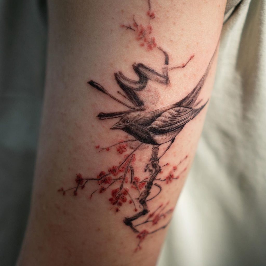 Endearing Bird And Cherry Blossom Tattoo
